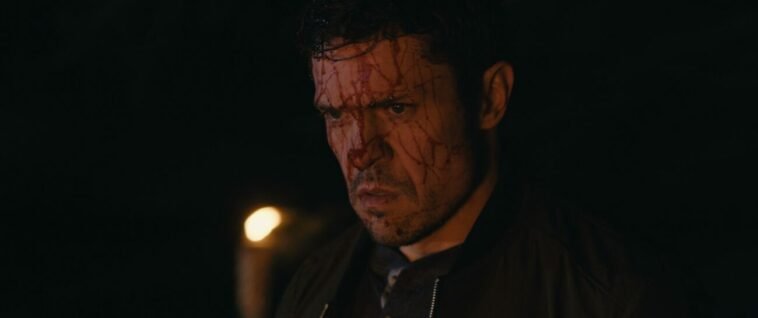 A man covered in blood