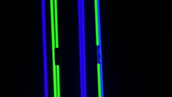 Multiple lasers point toward the sky and something obstructs it