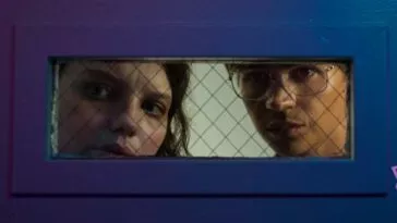 Gemma and Noah look through a door's observational window in Somnium