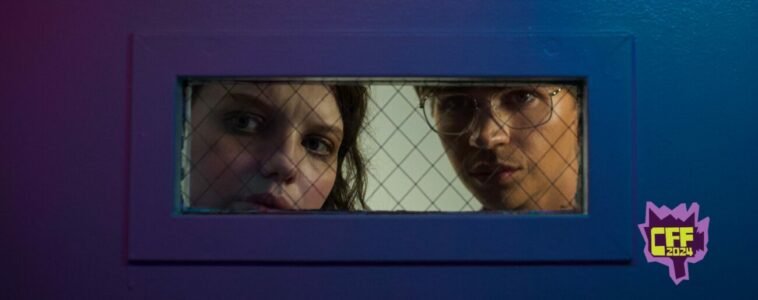 Gemma and Noah look through a door's observational window in Somnium