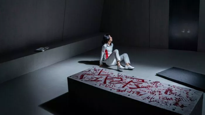 A woman sitting on the floor