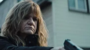 A woman holding a gun