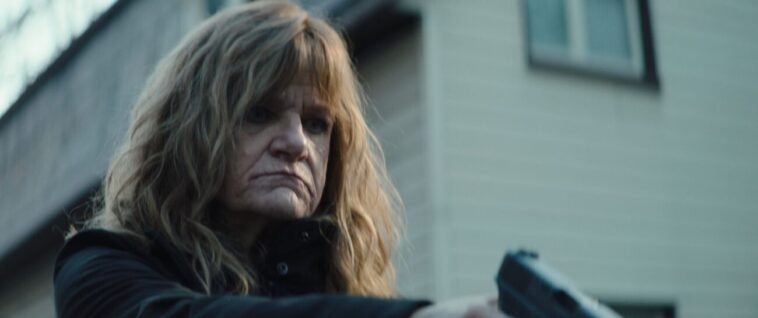 A woman holding a gun