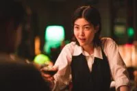 A bartender serving a drink