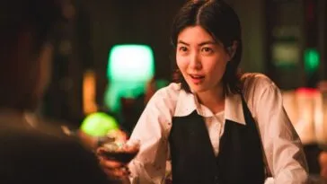 A bartender serving a drink