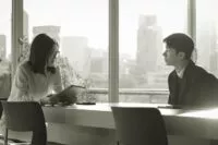 A man and a woman sitting and talking