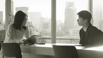 A man and a woman sitting and talking