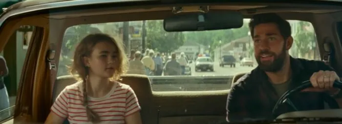 Lee and Regan in a car