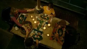 A family holding hands over the dinner table