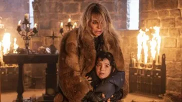 A woman holding a girl