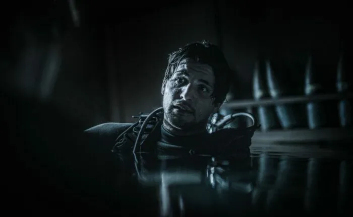 A man sticking his head out of the water
