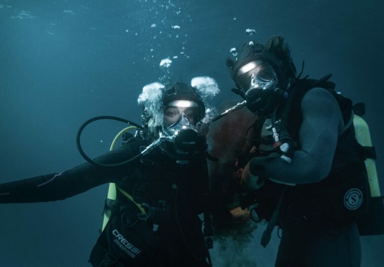 Two scuba divers in the water