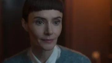 A woman with a slight smile