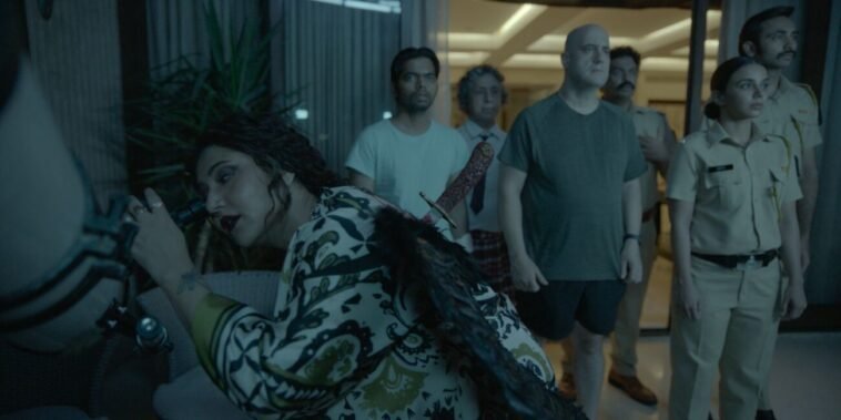 A group of people stand outside a sliding door in the night, one woman with a knife in her back is looking through a telescope