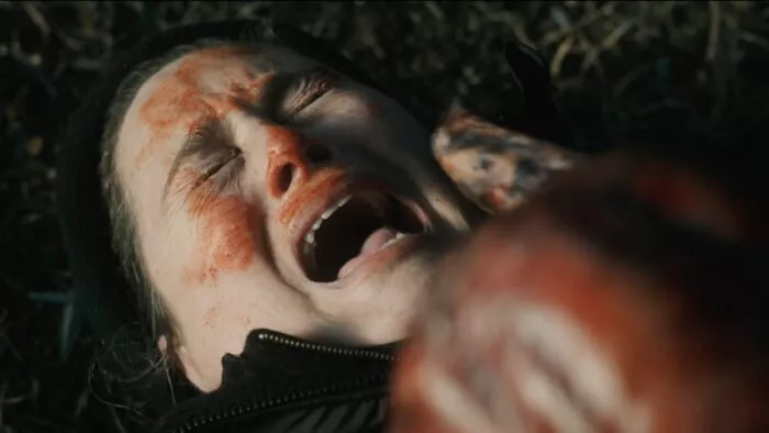 A woman being attacked by a monster