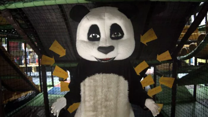 A man dressed as a panda