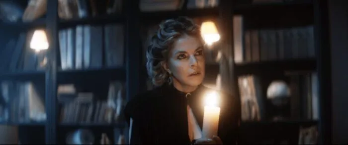 A woman holding a candle