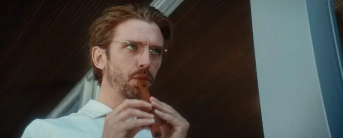 A man playing a small woodwind instrument