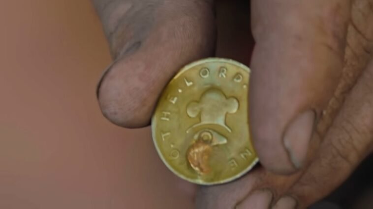Chad shows a gold Mormon coin