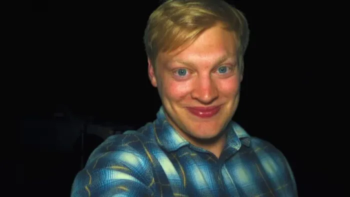 Milk smiling directly into the camera