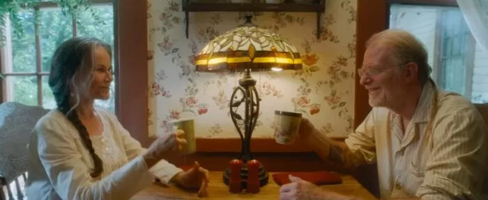 Two people drinking coffee together