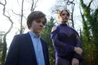 A woman and a boy at a funeral