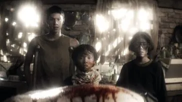 Three kids looking at a dead body