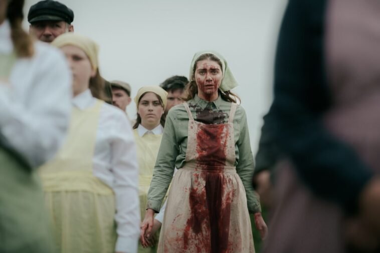 A woman covered in blood