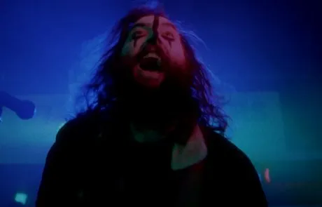 a man with a painted face screaming