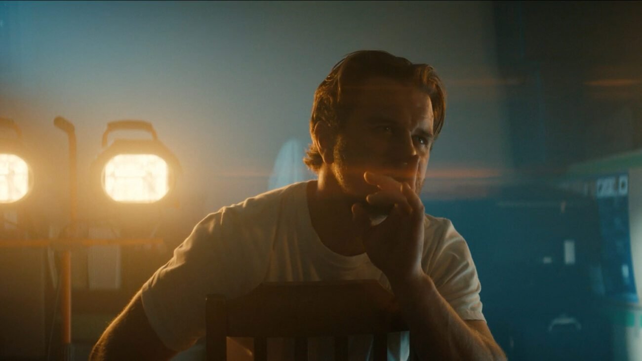 A man putting a finger to his lips