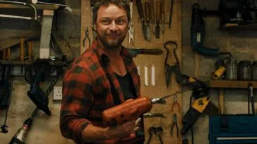 A man holding an electric drill