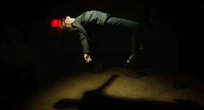 A priest floats in the center of a room