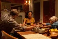 A family praying before a meal