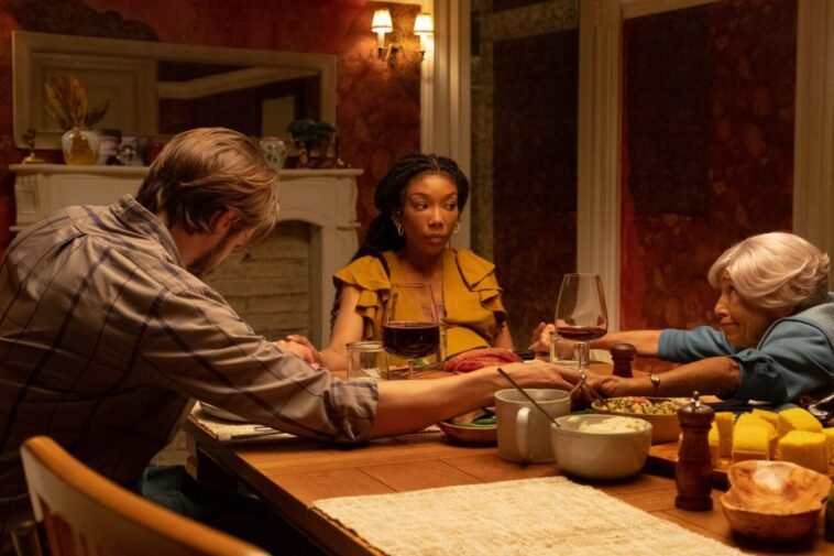 A family praying before a meal