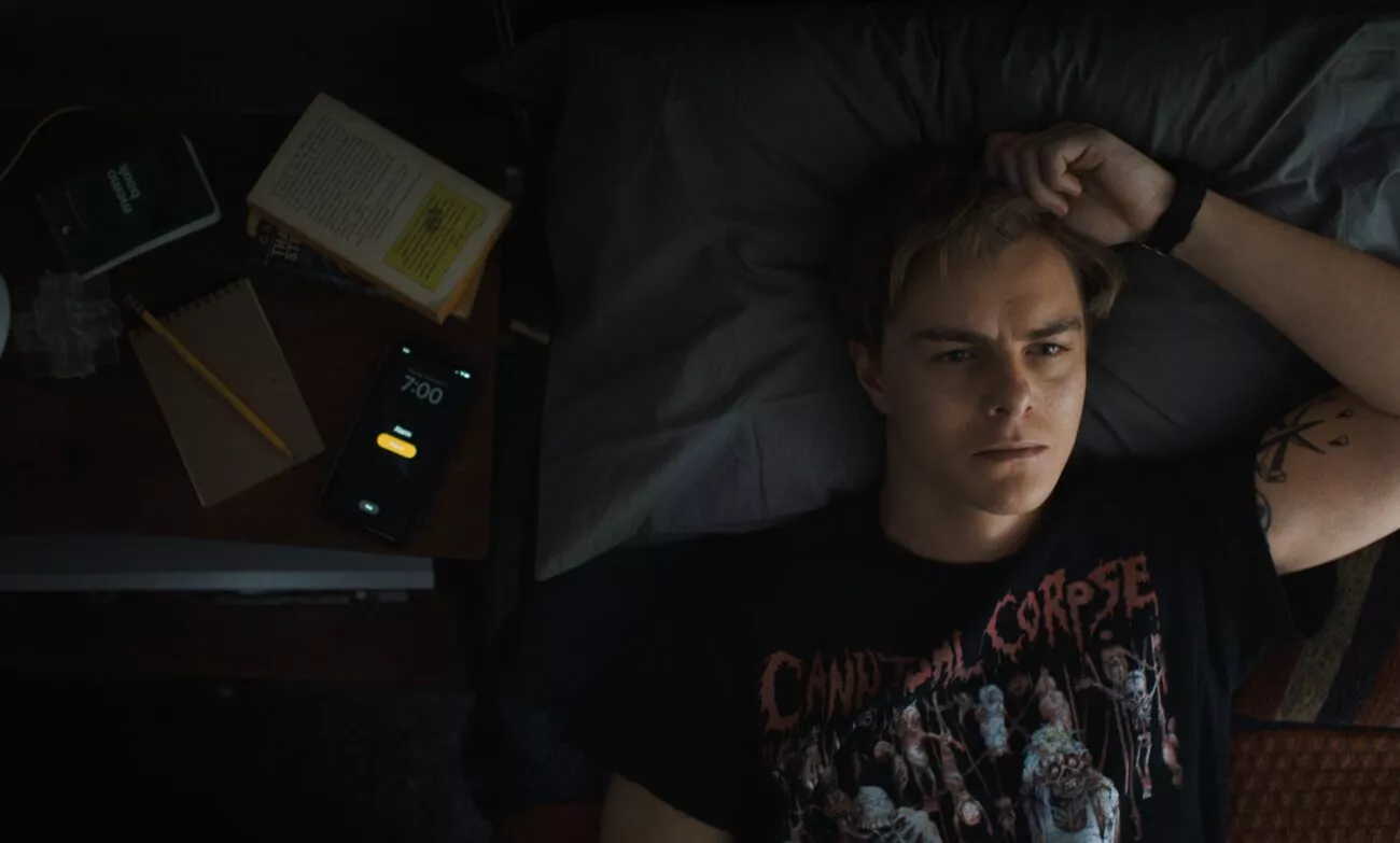 A men lying on his bed