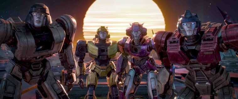 Four Transformers standing next to each other