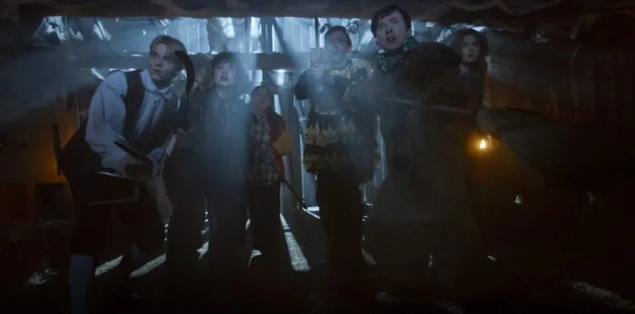 the light seeps into a barn and around the cast of characters in CARVED