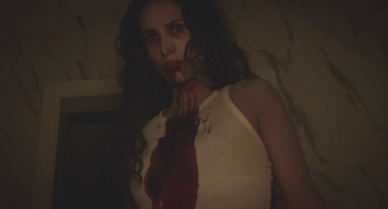 A woman with blood on her