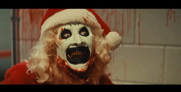 Art the Clown dressed up as Santa with a smile