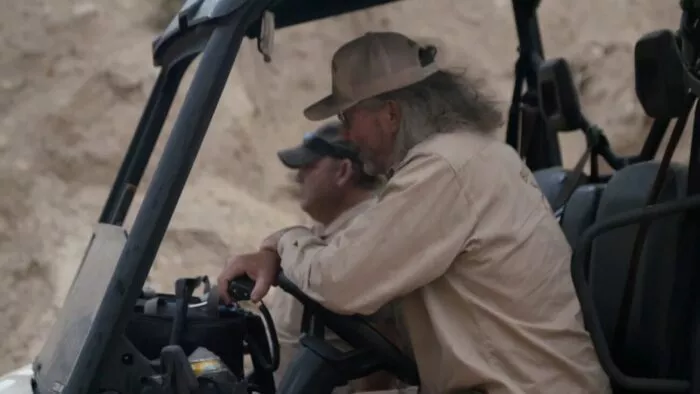 Duane and Jamie sit in the Side-by-Side, waiting for Chad to resurface