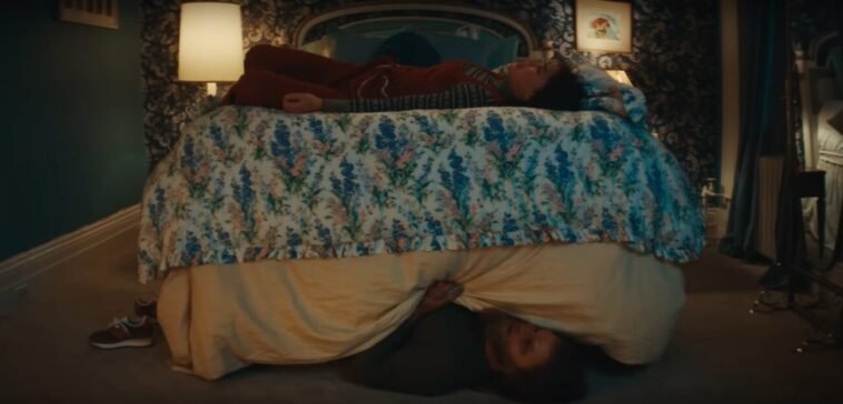 A woman talking to her monster under the bed