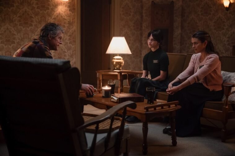 Three people sitting and talking