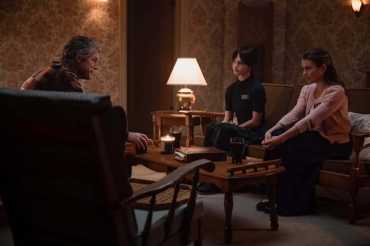 Three people sitting and talking