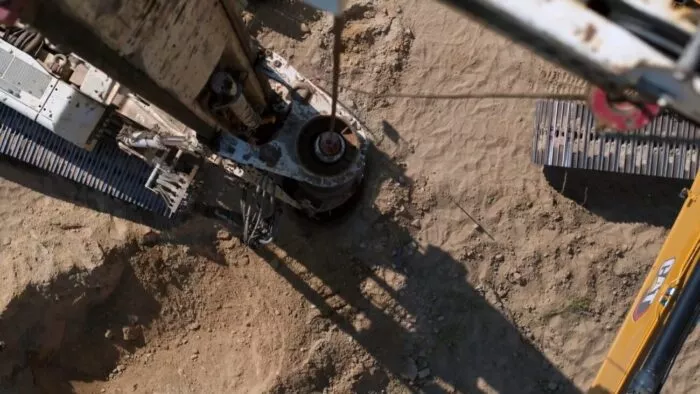 A top-down view of the rathole rig as it punches through the void