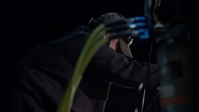 Jamie tends to the winch while the men are in the tunnels below