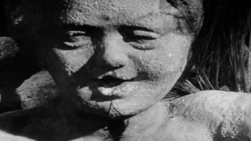 A bug crawling out of a statue