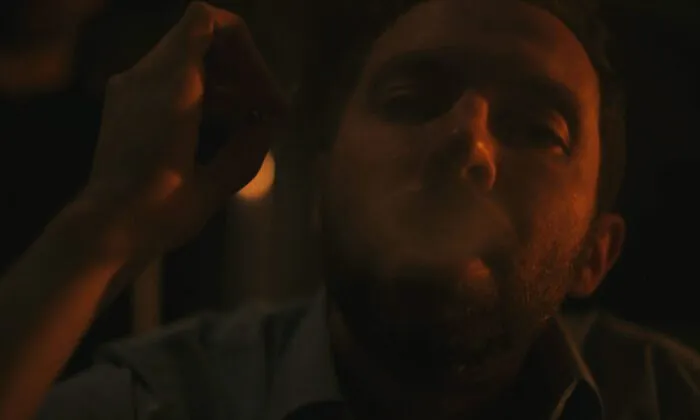 A man smoking a joint