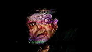 A distorted image of a man's face.