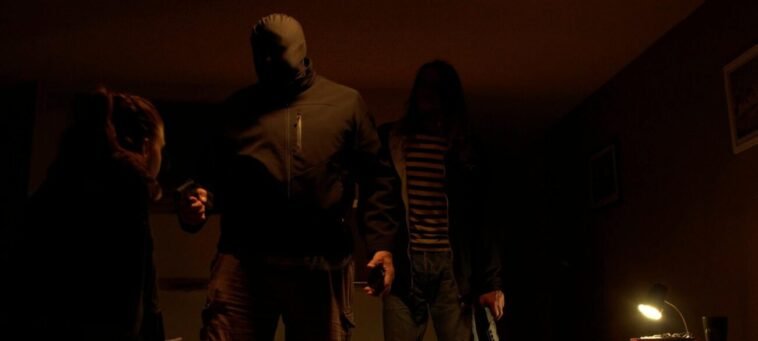 A masked man holds a weapon in HEMET, OR THE LANDLADY DON'T DRINK TEA