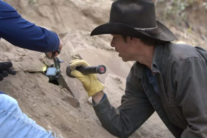 Josh Feldman peers into the stone altar.